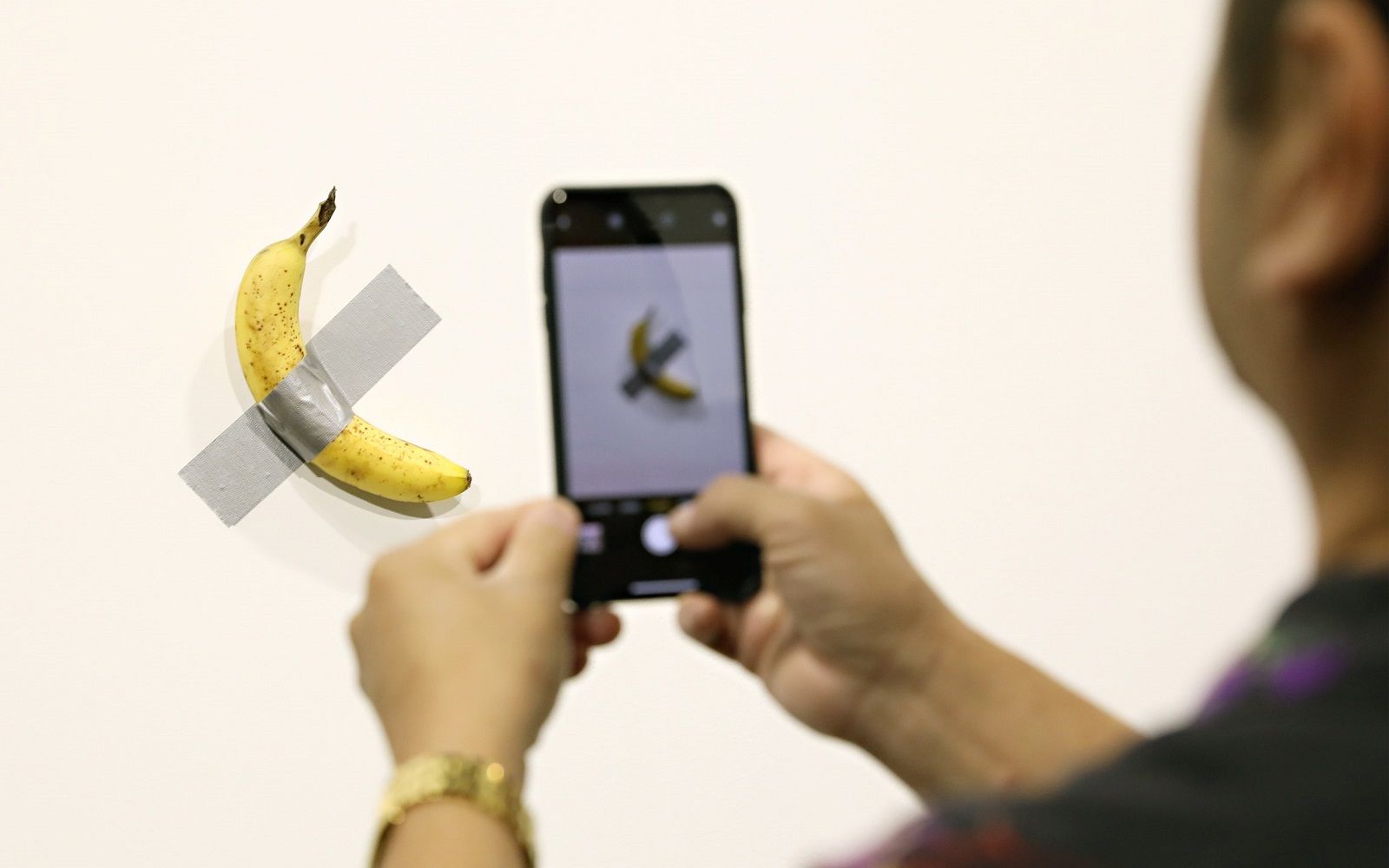 The complete history of Cattelan's duct-taped banana  The work was removed because it drew too large a crowd
