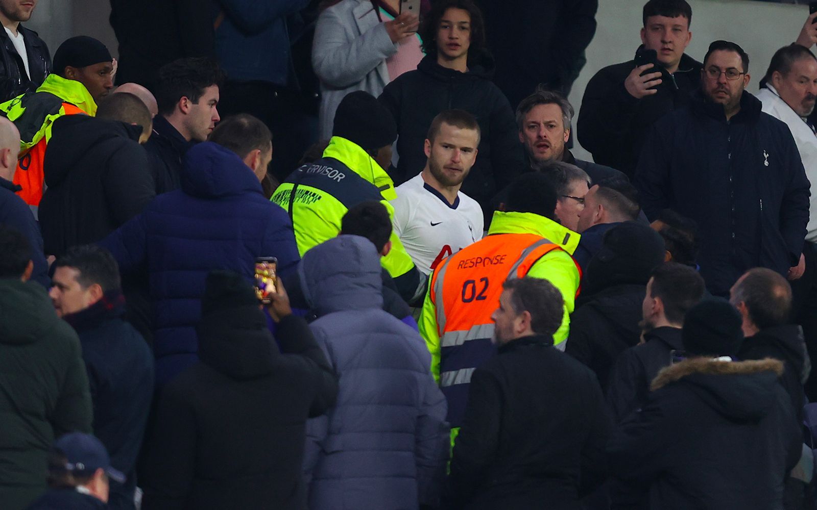 Eric Dier runs to the stands to attack a fan