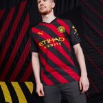 Manchester city red store and black kit