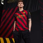 man city red and black shirt