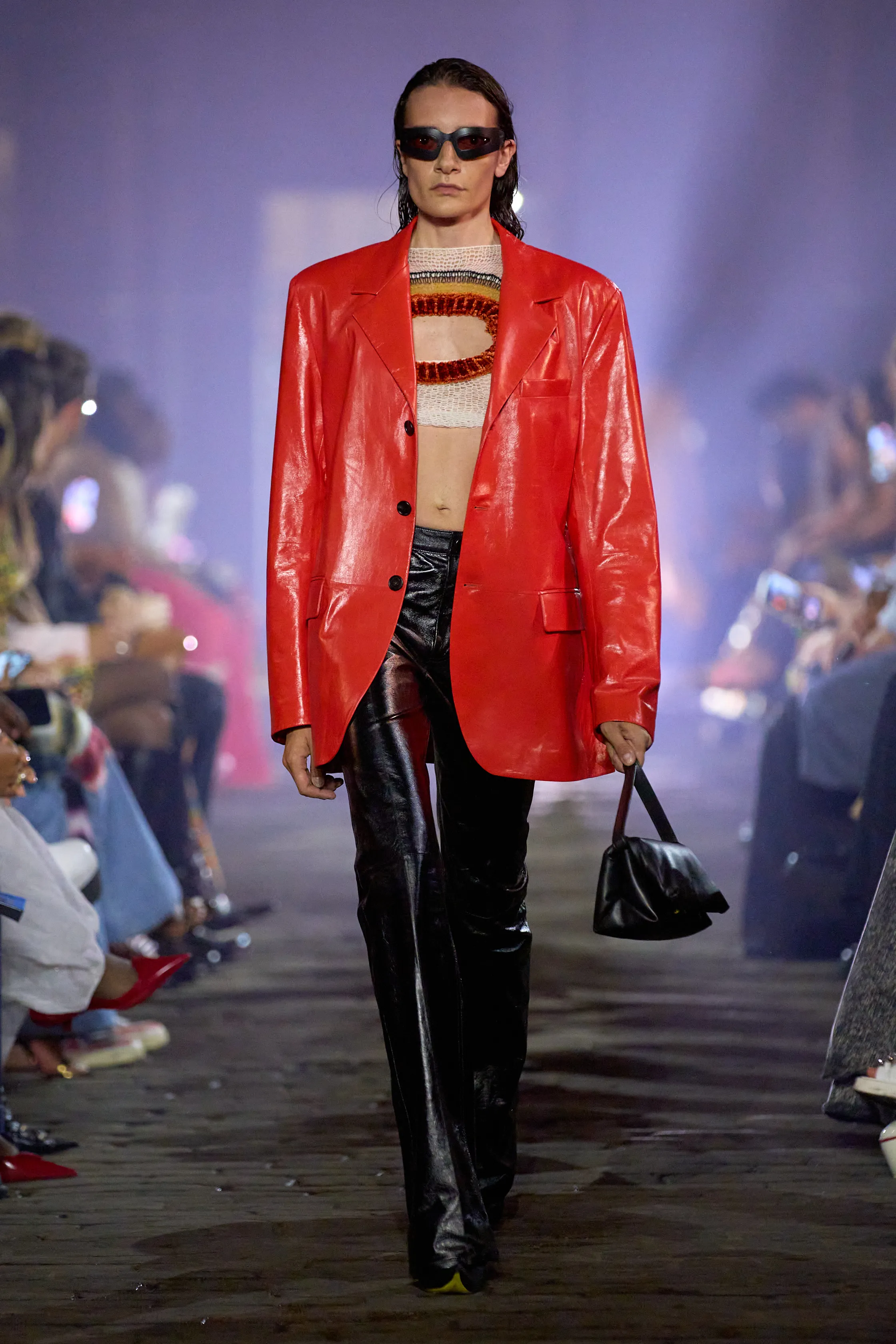 Woman with black leather Marni bag before Marni fashion show