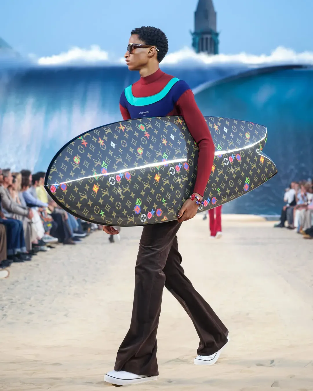Louis Vuitton Men surfs while the world overheats A wave for the 1% at the brand's SS27