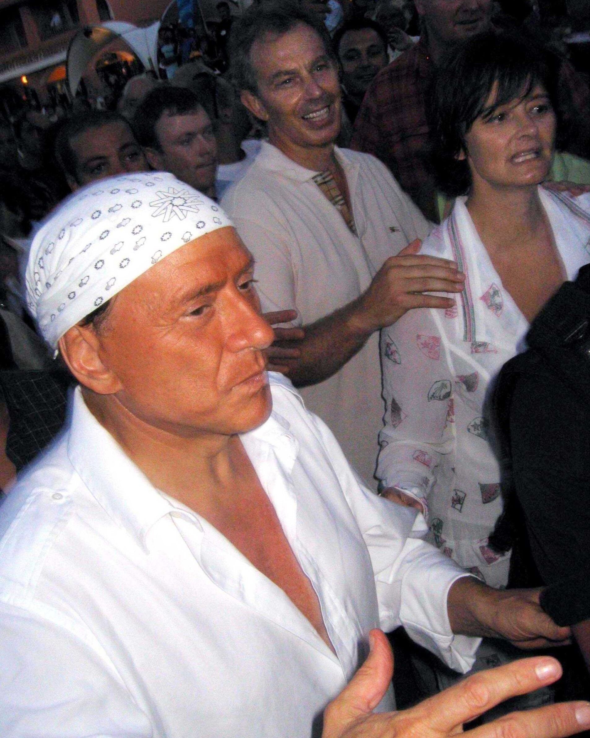 Italy is still stuck on Berlusconi Summer A world of bandanas, white shirts, and serenades with Apicella